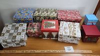 Ten assorted decorative gift boxes closed and lined up