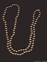 Full view of copper colour cultured pearl necklace laid out