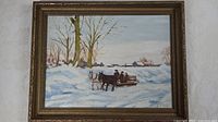 Full view of framed E.B. Tost winter sleigh ride painting