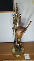 Full view of fireplace tool set on stand with bellows