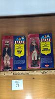 Both sealed Fun World Great Americans figures side by side with ruler for scale