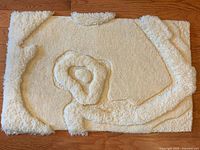 Full view of sheepskin mat showing overall design and size