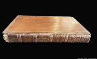 Side view of leather-bound Ancient Reliques showing worn gilt-tooled spine and boards