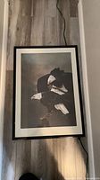Full framed print showing image of two bald eagles, black frame and mat