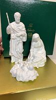 Front view of three Lenox Nativity figurines with box
