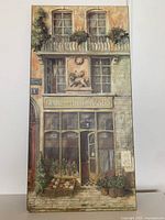 Full view of wood wall art depicting storefront