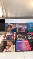 Six of the nine LPs laid out, showing Kenny Rogers, unidentified female vocalist, Band on the Run, Steve Miller Band, compilation and FM soundtrack covers