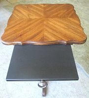 Top view showing scalloped square wood top and pull-out panel