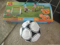 Box front showing Play Day Soccer Playset and loose soccer ball