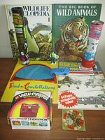 Group shot of books, View-Master box, glow-stick tubes, toy car and figurine