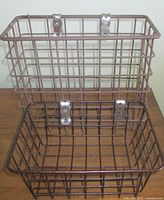 Both baskets front view showing size difference and clips