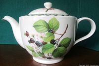 Right side view of Portmeirion Pomona Wild Blackberry teapot showing spout, handle and botanical design