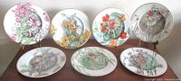 Group shot of seven fairy plates