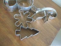 All six aluminum cookie cutters displayed on table