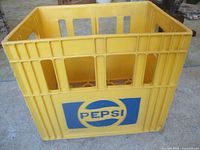 Front view of yellow Pepsi crate showing logo