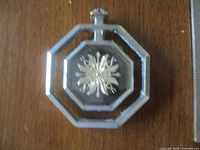 Close-up of Pontiac Parisienne emblem ornament