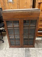 Front view showing two glass-pane doors and overall structure