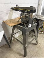 Full view DeWalt radial arm saw on metal stand