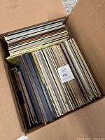 Box filled with vertically stacked vinyl LPs