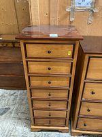 Front view showing seven drawers and overall finish