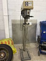 Full view of floor drill press showing column, base, table and head