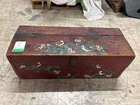 Top view of closed wooden box with bird and floral enamel painting