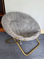 Full view of grey faux fur folding papasan chair