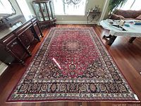 Rug full view in room showing size and colours