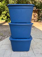 Front view of three stacked blue storage totes