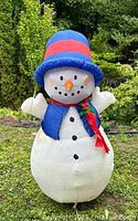 Front view of inflatable snowman fully inflated outdoors