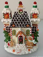 Front view of fibre-optic gingerbread house showing overall design