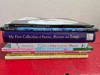 spine view of all eight hardcover picture books