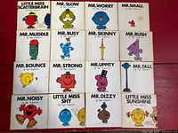 All 16 books laid out in 4x4 grid, front covers visible