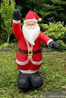 Front view of fully inflated 5 ft Santa Claus decoration standing outdoors