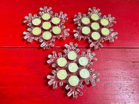 All three glass snowflake holders with tealights displayed