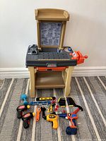 Full view of Step2 workbench with tools arranged on floor