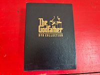 Front of black slipcase with gold title