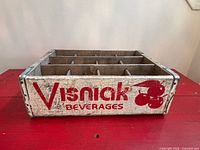 Side view displaying Visniak Beverages logo and overall wear