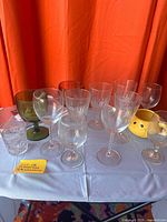 Full group of glassware, mug and cutting board on table