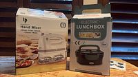 Box fronts showing Lilpartner hand mixer and electric lunchbox