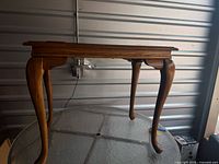 Side table full view showing cabriole legs and rectangular top