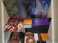 Stacked album covers showing Black Sabbath, Roxy Music Manifesto, Yes Going for the One and other records