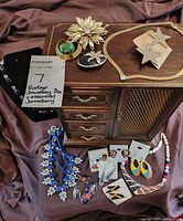 overall view of jewellery chest and assorted jewellery laid out