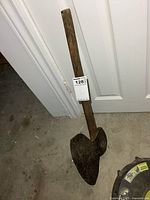 Full view of broad axe showing complete handle and head