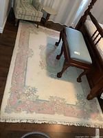 Full view of area rug beside furniture