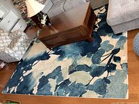 Full view of rug under coffee table and seating