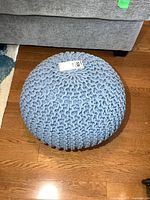 angled view of full pouf showing knit texture and color