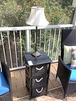 Overall view of stand with baskets and lamp