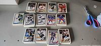 Top-down view of multiple stacks of 1991 O-Pee-Chee hockey cards on table