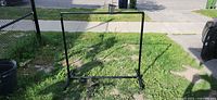 Front view of assembled garment rack outdoors